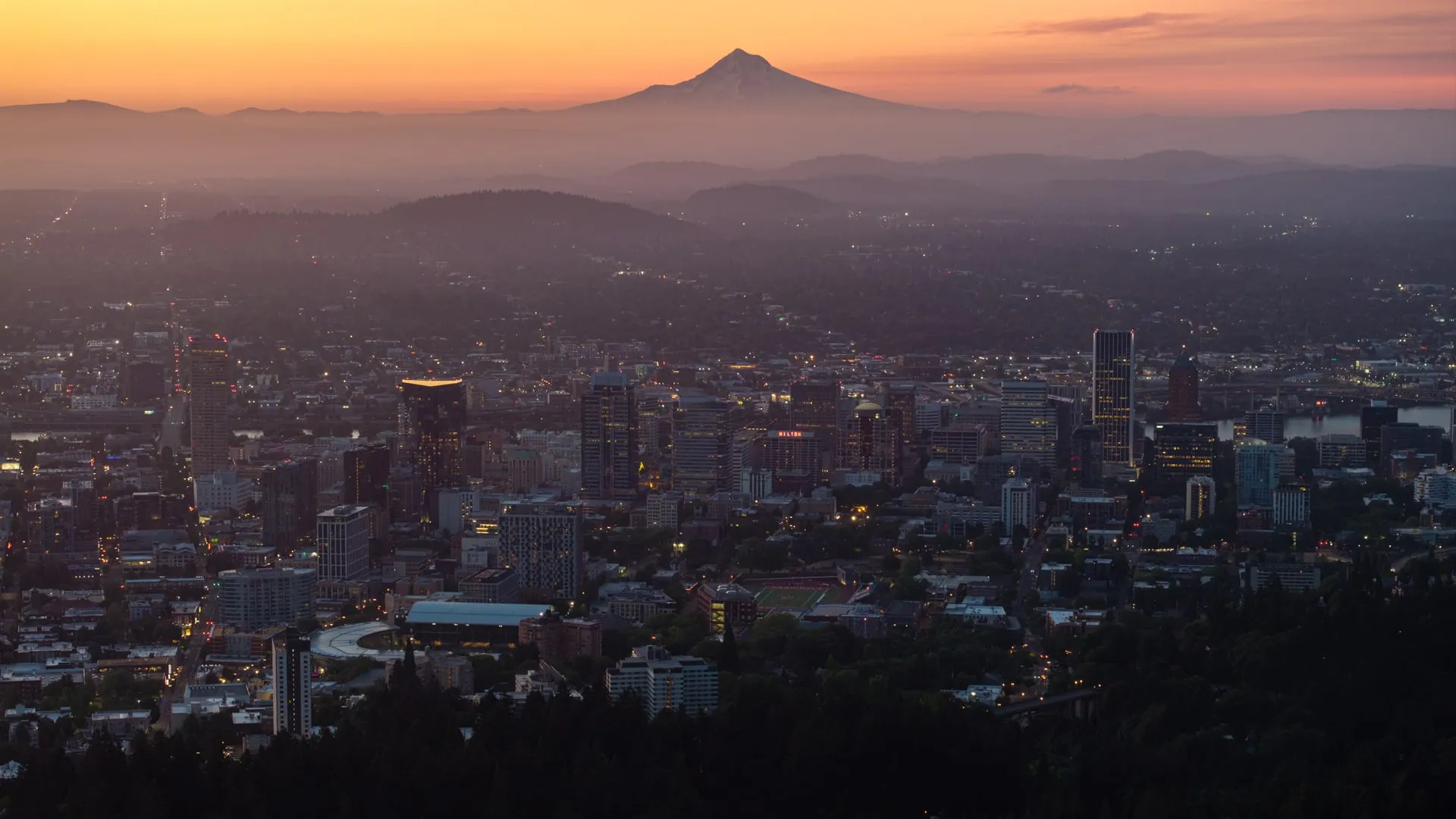 Downtown Portland, Oregon, at dawn with Mount Hood on the horizon.
