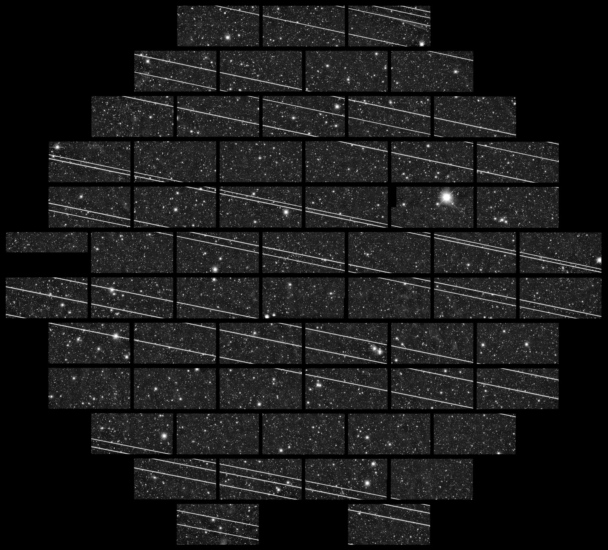 A mosaic of rectangular camera detectors showing a star field crossed by many parallel bright diagonal lines.